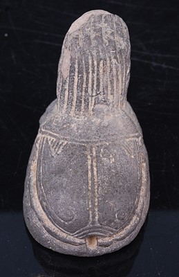 Lot 388 - An Egyptian moulded and tooled terracotta seal,...