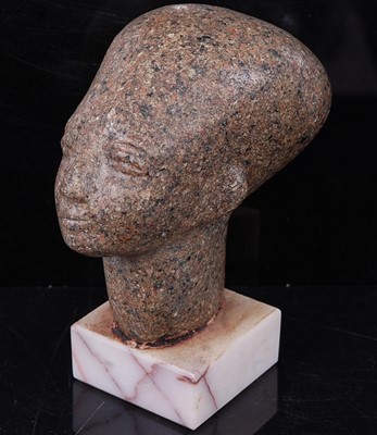 Lot 391 - An Egyptian Aswan granite head of a Pharoah,...