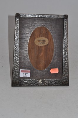 Lot 217 - An Arts & Crafts oak and hammered copper clad...