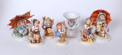 Lot 230 - A collection of four Hummel figures, to...