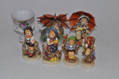 Lot 225 - A collection of four Hummel figures, to...