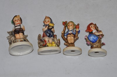Lot 225 - A collection of four Hummel figures, to...