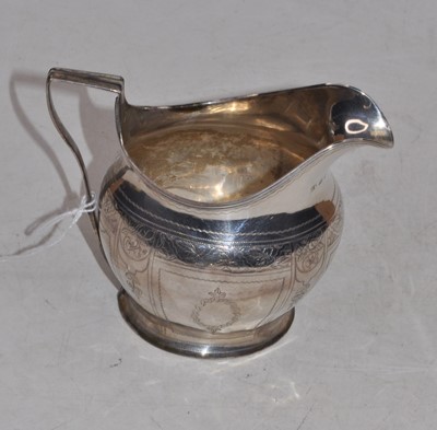Lot 281 - A George III silver helmet shaped cream jug,...