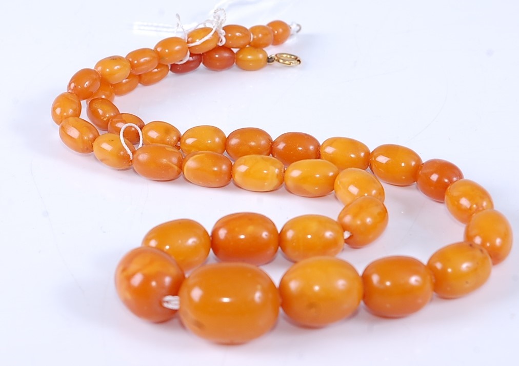 Lot 308 - A beaded faux butterscotch amber necklace,