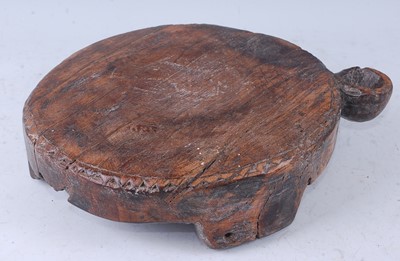 Lot 304 - A teak chapati board, of circular form within...
