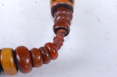 Lot 193 - A large Berber amber Copal necklace, strung as...