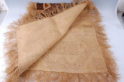Lot 196 - A raffia cloth, woven as an inter linked...