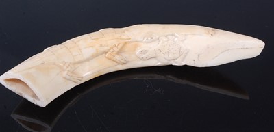 Lot 198 - A boar's tusk, carved with a crocodile and...