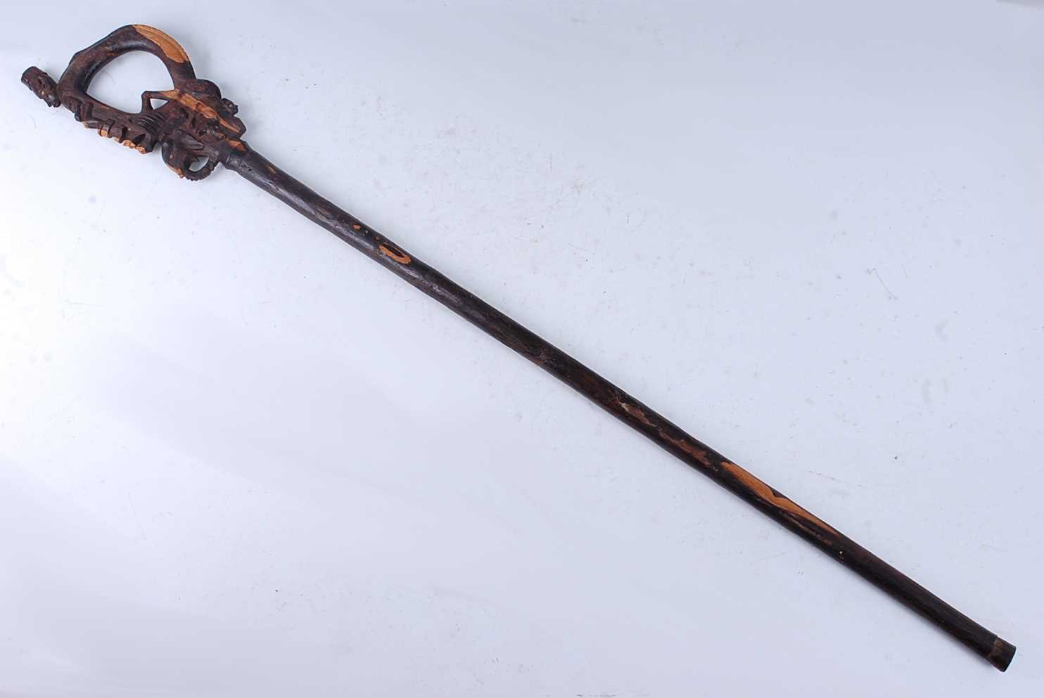 Lot 201 - An unusual East African staff, the tip carved...