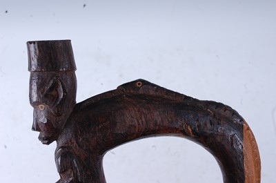 Lot 201 - An unusual East African staff, the tip carved...
