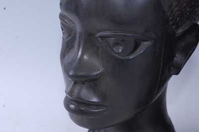 Lot 203 - A pair of East African ebony busts, carved as...