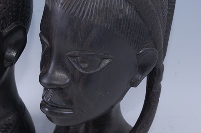 Lot 203 - A pair of East African ebony busts, carved as...