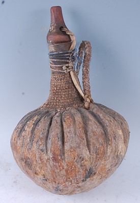 Lot 206 - An African husk/calabash gourd drinking vessel,...