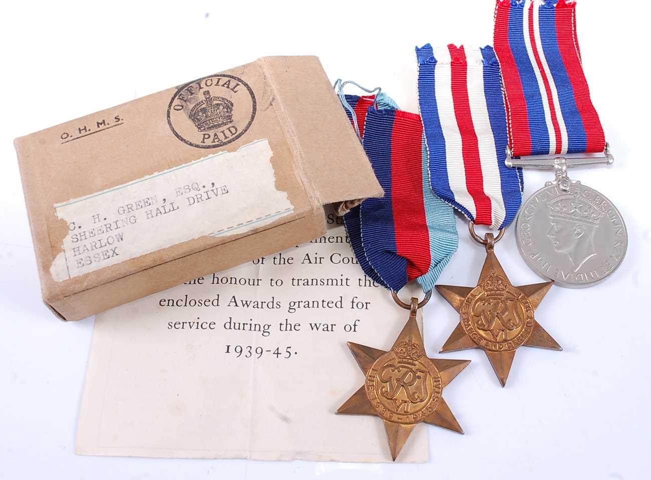 Lot 14 - A collection of three WW II medals, to include...