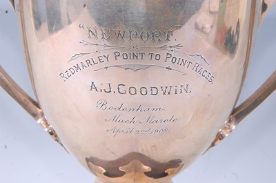 Lot 296 - An Edwardian silver trophy cup, having twin...