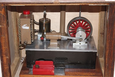 Lot 173 - A wooden cased model of a beam engine powered...