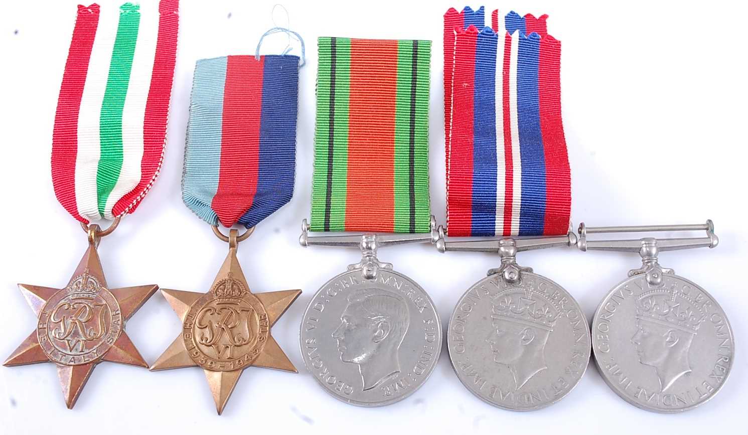 Lot 118 - A collection of five WW II medals, to include...