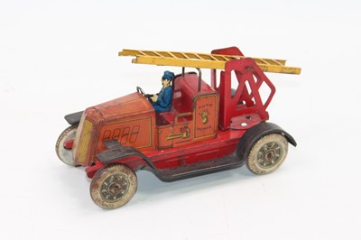 Lot 1438 - Unis (France) tinplate clockwork "Auto Pompe"...