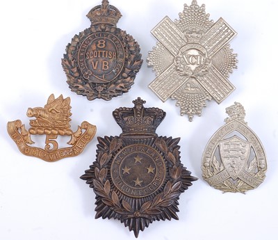 Lot 200 - A large collection of cap badges, glengarry...
