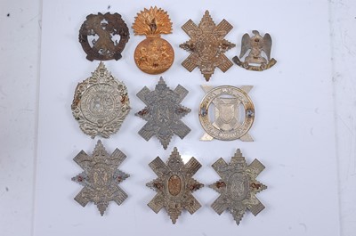 Lot 200 - A large collection of cap badges, glengarry...
