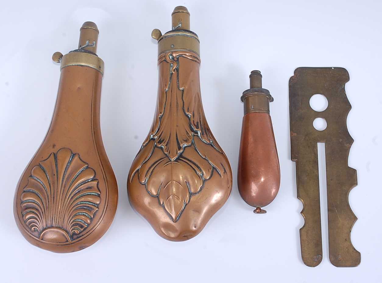Lot 180 - A 19th century copper powder flask of typical...