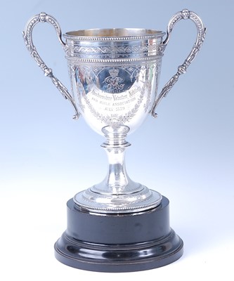 Lot 12 - A Victorian silver trophy cup, having floral...