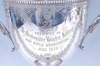 Lot 12 - A Victorian silver trophy cup, having floral...
