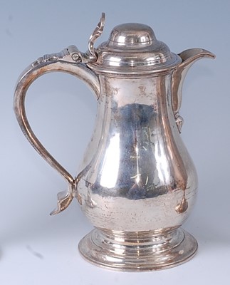 Lot An early George III silver wine or beer jug,...