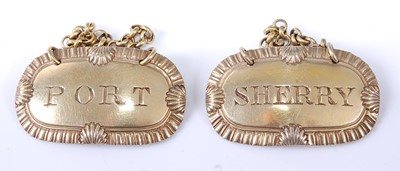 Lot 2233 - * A pair of George IV silver gilt wine labels,...