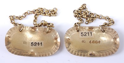 Lot 2233 - * A pair of George IV silver gilt wine labels,...