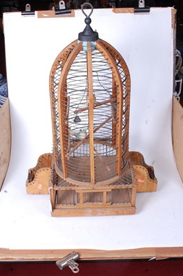 Lot 11 - A large softwood and wirework birdcage, of...