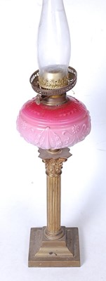 Lot 13 - A Victorian oil lamp, having a pressed pink...