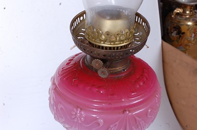 Lot 13 - A Victorian oil lamp, having a pressed pink...