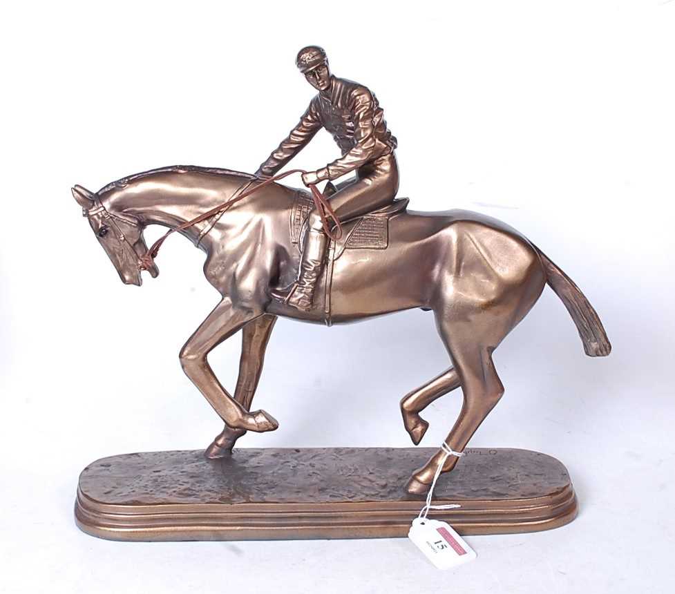 Lot 15 - A reproduction bronzed resin figure of a...