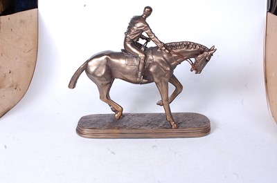 Lot 15 - A reproduction bronzed resin figure of a...