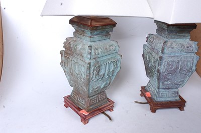 Lot 25 - A pair of Chinese bronze table lamps, of...