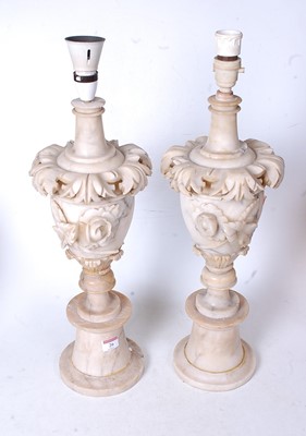 Lot 26 - A pair of early 20th century onyx table lamps,...
