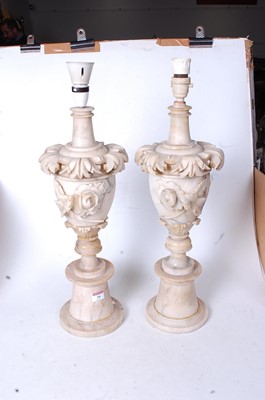 Lot 26 - A pair of early 20th century onyx table lamps,...