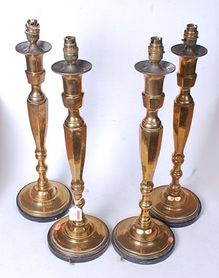 Lot 27 - A set of four 20th century turned brass table...