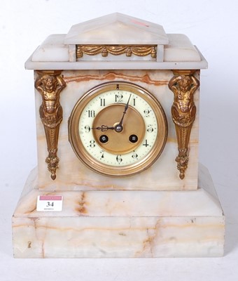 Lot 34 - A late Victorian alabaster cased mantel clock,...