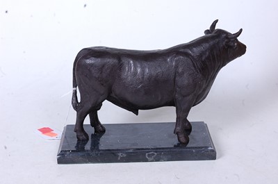 Lot 48 - A bronze model of a bull in standing pose on...