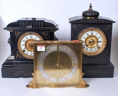 Lot 59 - A late Victorian black slate mantel clock of...
