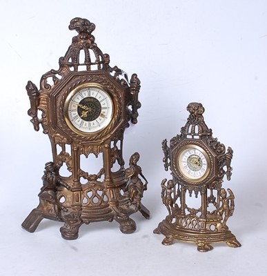 Lot 44 - A reproduction pressed brass mantel clock,...