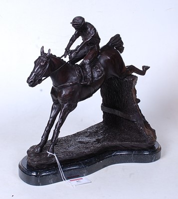 Lot 46 - A bronzed figure of a racehorse and jockey...