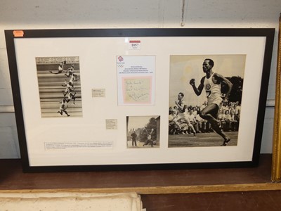 Lot 1057 - A framed display of cuttings commemorating...