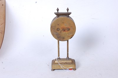 Lot 65 - A late 19th century brass cased mystery clock,...