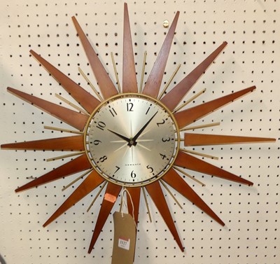 Lot 1127 - A 1970s Newgate sunburst circular wall clock,...