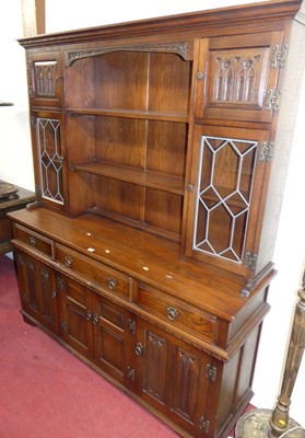 Lot 1132 - A contemporary Old Charm linenfold moulded oak...