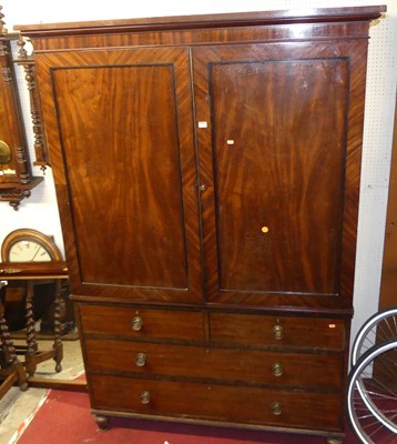 Lot 1134 - A Regency mahogany and ebony strung linenpress,...