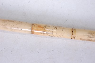 Lot 119 - A faux ivory walking stick, each section...